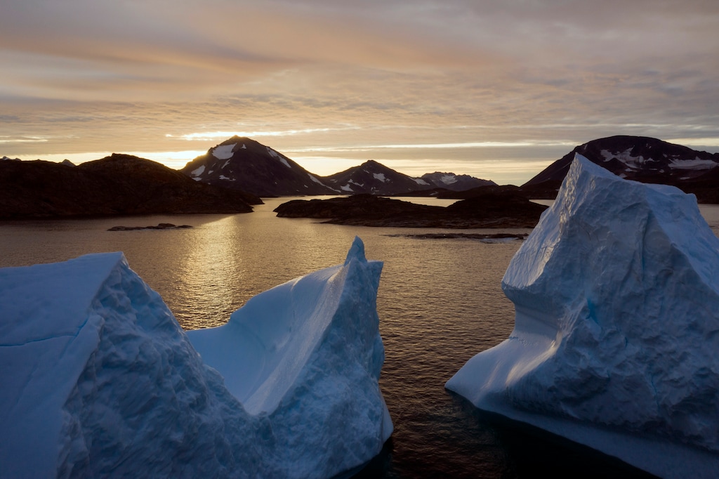 (Felipe Dana | AP file photo) This Friday, Aug. 16, 2019 photo shows an aerial view of large Icebergs floating as the sun rises near Kulusuk, Greenland. Greenland has been melting faster in the last decade, and this summer, it has seen two of the biggest melts on record since 2012. A special United Nations-affiliated oceans and ice report released on Wednesday, Sept. 24, 2019 projects three feet of rising seas by the end of the century, much fewer fish, weakening ocean currents, even less snow and ice, and nastier hurricanes, caused by climate change.