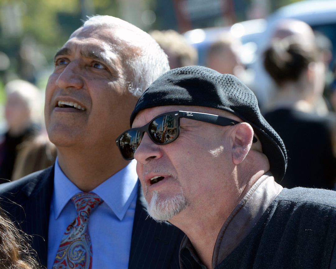 (Al Hartmann  |  The Salt Lake Tribune) 	
Salt Lake County District Attorney Sim Gill, left, and  artist Gordon Huether look at the detail of the new glass art covering the façade of the downtown District Attorney building at 35 E. 500 S. in Salt Lake City.  It was unveiled Wednesday September 27.    The glass artwork is complete, but the building is currently under construction to be completed in Spring 2018.