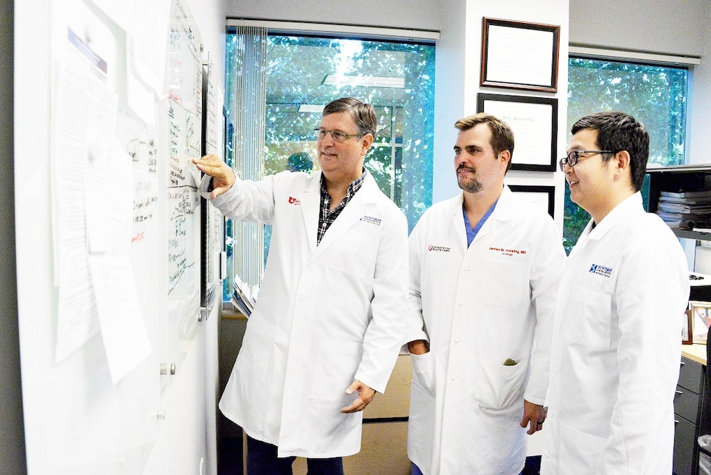 (Photo courtesy of Huntsman Cancer Institute) Bradley R. Cairns (left), senior director of basic science at Huntsman Cancer Institute and professor and chair of oncological sciences at the University of Utah; with fellow researchers James M. Hotaling, MD and assistant professor of surgery at the U.; and predoctoral student Jingtao Guo. The trio and others published research Thursday that breaks new ground in describing the changes human sperm stem cells go through as they mature, shedding light on infertility and cancer.