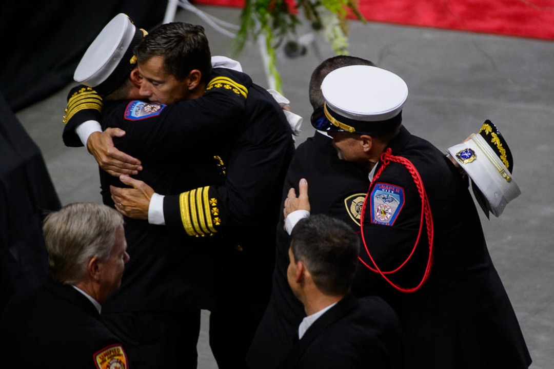 (Trent Nelson | The Salt Lake Tribune)  Funeral services for Battalion Chief Matthew Burchett at the Maverik Center in West Valley City, Monday Aug. 20, 2018.