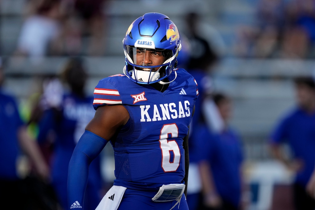 (Charlie Riedel | AP) Kansas quarterback Jalon Daniels warms up before an NCAA college football game against Missouri State Friday, Sept. 1, 2023, in Lawrence, Kan.