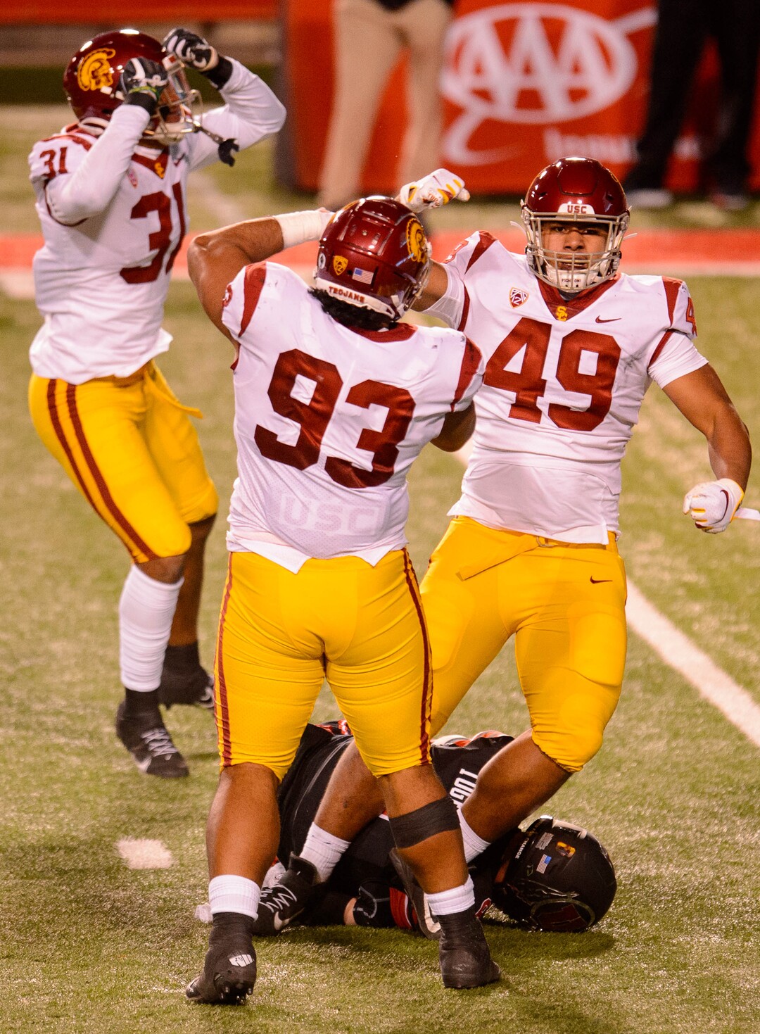 (Trent Nelson  |  The Salt Lake Tribune) USC Trojans defensive lineman Tuli Tuipulotu (49) celebrates after sacking Utah Utes quarterback Jake Bentley (8), as the Utah Utes host the USC Trojans, NCAA football at Rice-Eccles Stadium in Salt Lake City on Saturday, Nov. 21, 2020.
