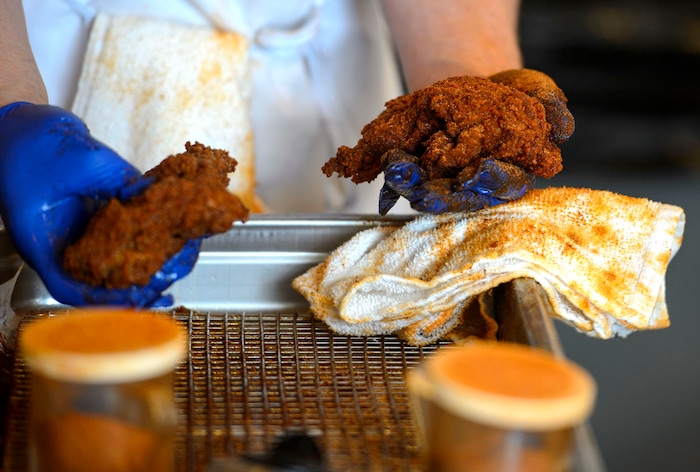 (Steve Griffin  |  The Salt Lake Tribune)  Seasoned chicken is ready to be made into a sandwich at Pretty Bird, a new Nashville-style hot chicken restaurant on Regent Street, in Salt Lake City Monday April 23, 2018.