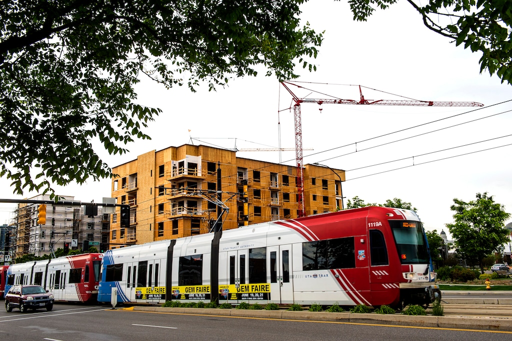 Chris Detrick | The Salt Lake Tribune
The Trax Red Line goes past construction along 400 South and 500 East in 2015.