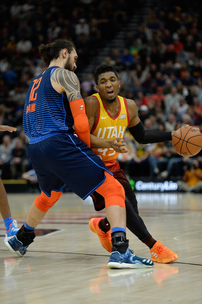 (Francisco Kjolseth  |  The Salt Lake Tribune)   Oklahoma City Thunder center Steven Adams (12) puts the block on Utah Jazz guard Donovan Mitchell (45) in the NBA game at Vivint Smart Home Arena Sat., Dec. 22, 2018, in Salt Lake City.