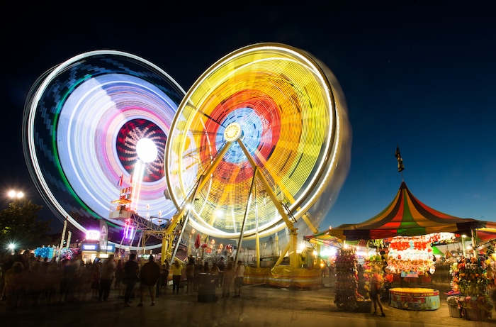 (Rick Egan  |  The Salt Lake Tribune)  The Midway glows at night at the Utah State Fair,  Monday, September 11, 2017.


