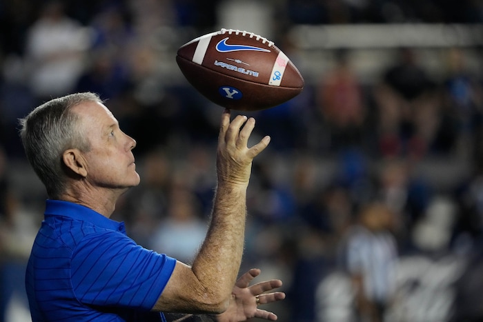 (Francisco Kjolseth | The Salt Lake Tribune) Ball boy Scott Eldridge twirls a ball on the sidelines during a media time out in the game between the Brigham Young Cougars and the South Florida Bulls at LaVell Edwards Stadium in Provo, Saturday, Sept. 25, 2021.