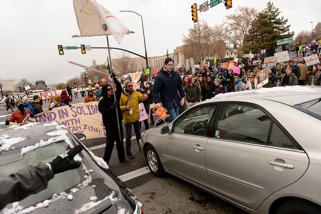 (Trent Nelson | The Salt Lake Tribune)  Protesters clash with motorists after blocking off an intersection after a rally against a visit by President Donald Trump, Monday December 4, 2017.