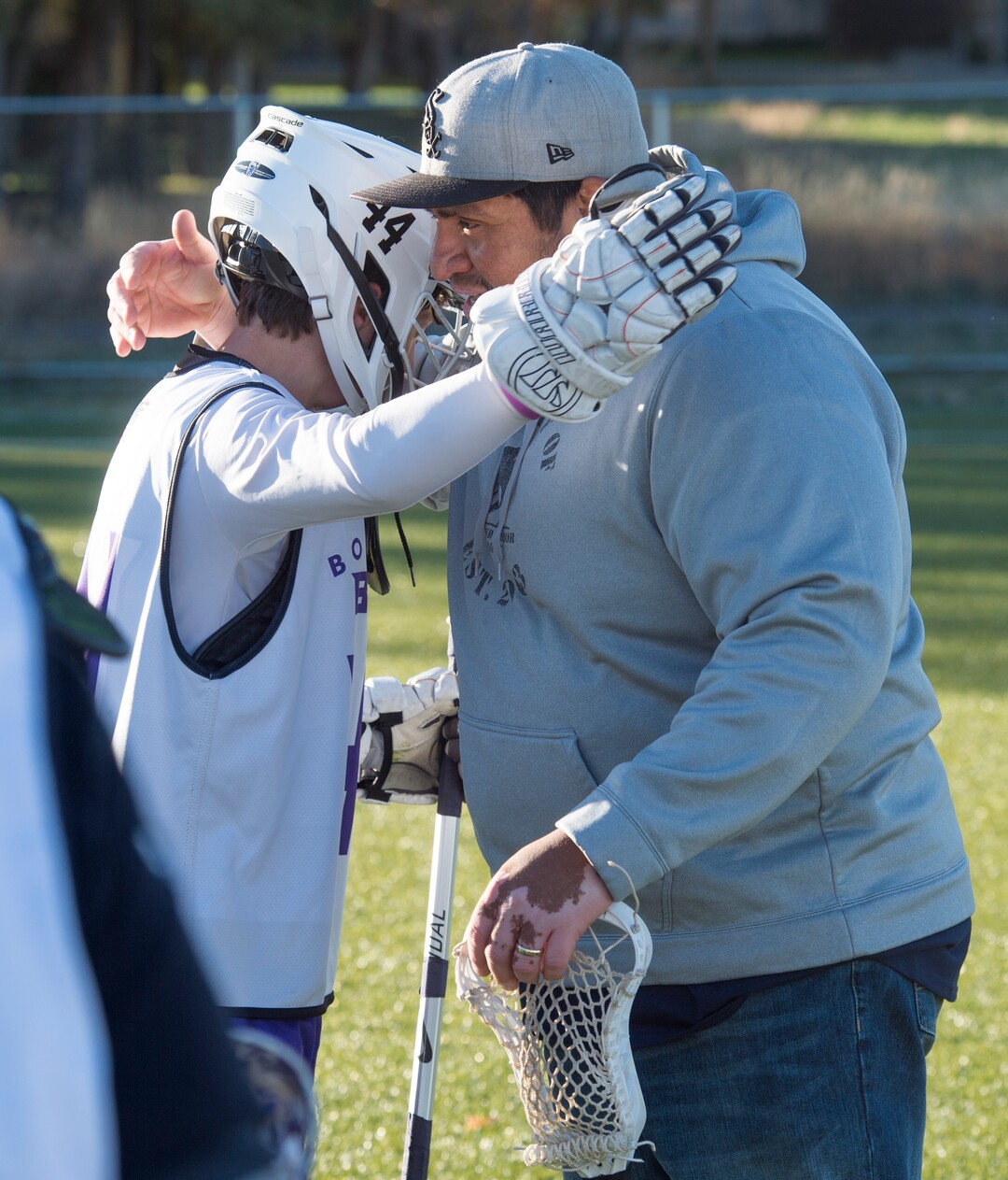 (Rick Egan | The Salt Lake Tribune) Player Seth Linvulle gets a hug from Box Elder lacrosse coach Juan Gaytan during a tournament in Logan on Saturday, Nov. 3, 2018.