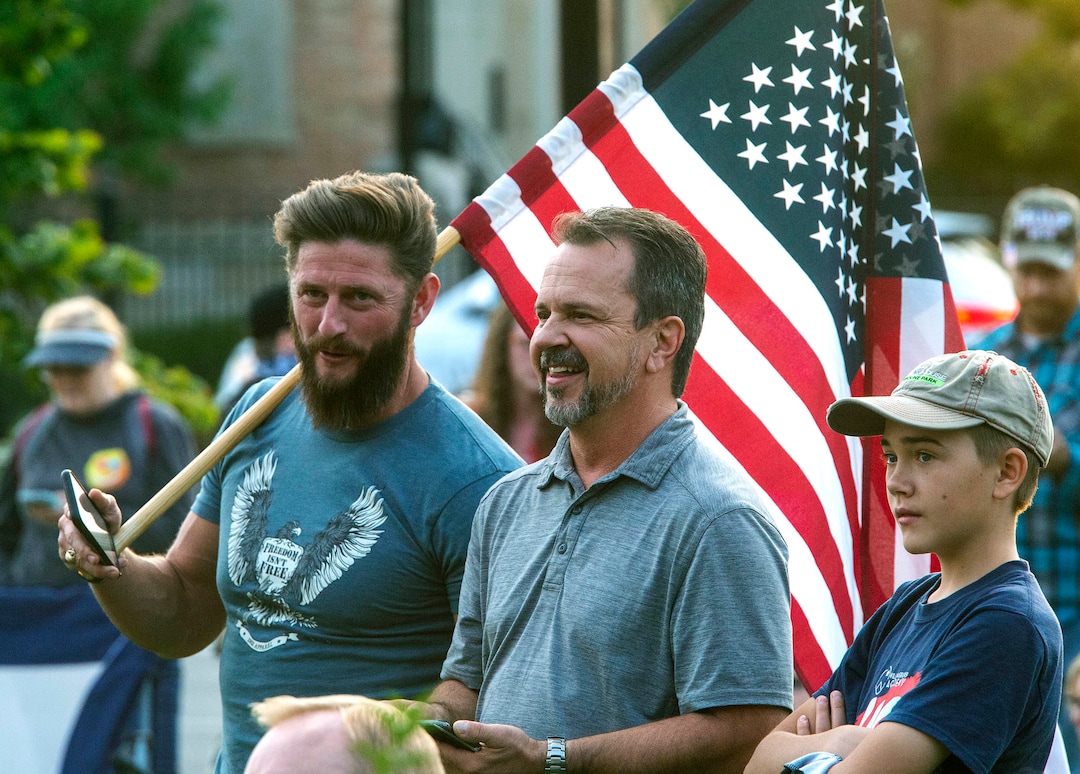 (Rick Egan  |  The Salt Lake Tribune)     Several people carried guns, but no one was wearing masks, as a couple of hundred people gather at the Provo Courthouse for the Utah County Freedom Rally on Friday, Oct. 2, 2020.