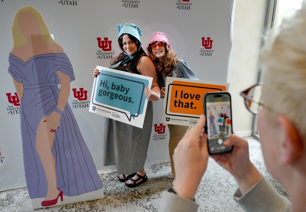 (Francisco Kjolseth | The Salt Lake Tribune) Amy Elms, left, and Amanda Hoyt get in on the fun as they pose for a picture while attending a symposium at the University of Utah Tanner Humanities Center that asks about the societal impact of The Real Housewives of Salt Lake City, on Friday, April 10, 2026.