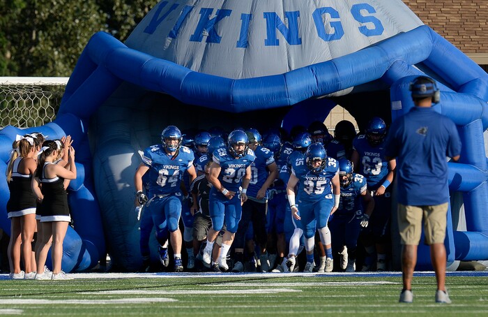 (Scott Sommerdorf | The Salt Lake Tribune) The Pleasant Grove Vikings take the field to start their 2017 season as Corner Canyon matches up with Pleasant Grove, Friday, August 18, 2017.