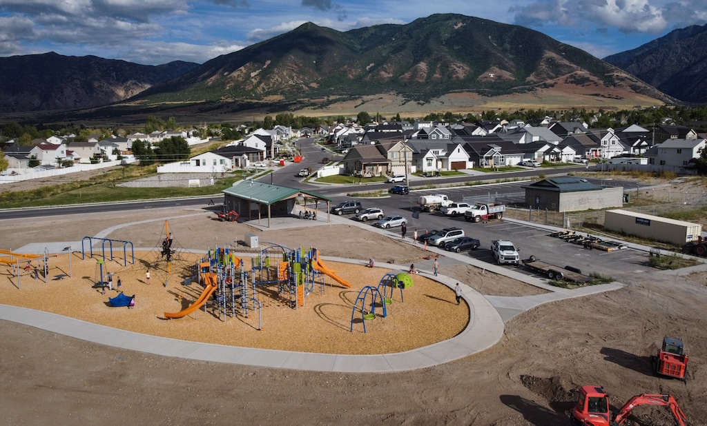 (Bethany Baker | The Salt Lake Tribune) People recreate at a park near a subdivision in Tooele County on Saturday, Sept. 2, 2023. Tooele is the fastest growing county in Utah. Local leaders are trying is to turn the Salt Lake County bedroom community into a destination all its own.