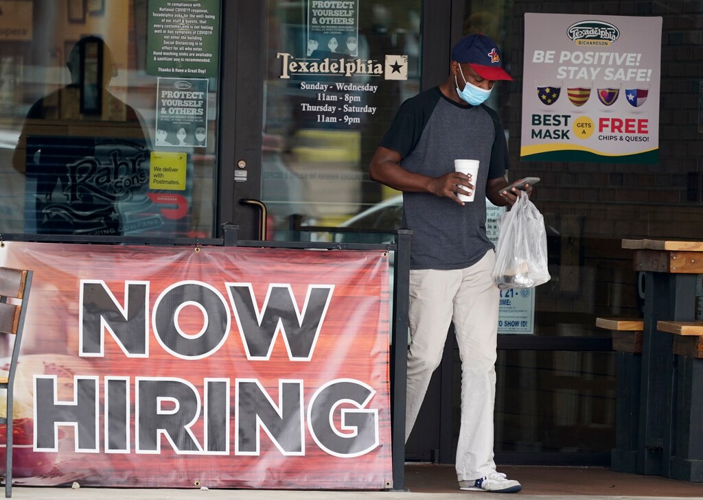 (LM Otero | AP) a customer walks past a now hiring sign at an eatery in Richardson, Texas, Sept. 2, 2020. The Labor Department reported unemployment numbers Thursday, Sept. 3.
