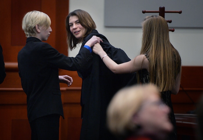 (Scott Sommerdorf   |  The Salt Lake Tribune)   during the Paige Petersen tries on her new robe with the help of her nephew Colin Petersen, left, and niece Jaden Olaveson, prior to her investiture ceremony as the new Utah Supreme Court justice, Friday, January 19, 2018.
