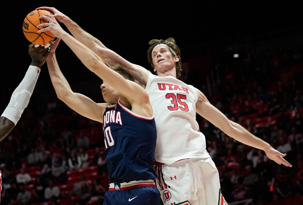 (Francisco Kjolseth | The Salt Lake Tribune) Utah Utes center Branden Carlson (35) shows his wingspan against Arizona Wildcats forward Azuolas Tubelis (10) as the University of Utah hosts the Arizona Wildcats in NCAA basketball in Salt Lake City on Thursday, Dec. 1, 2022.