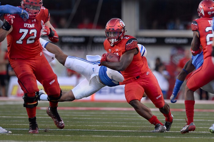 Scott Sommerdorf   |  The Salt Lake Tribune  
Utah RB Zack Moss look for running room up the middle during first half play. Utah led BYU 14-13 at the half, Saturday, September 10, 2016.