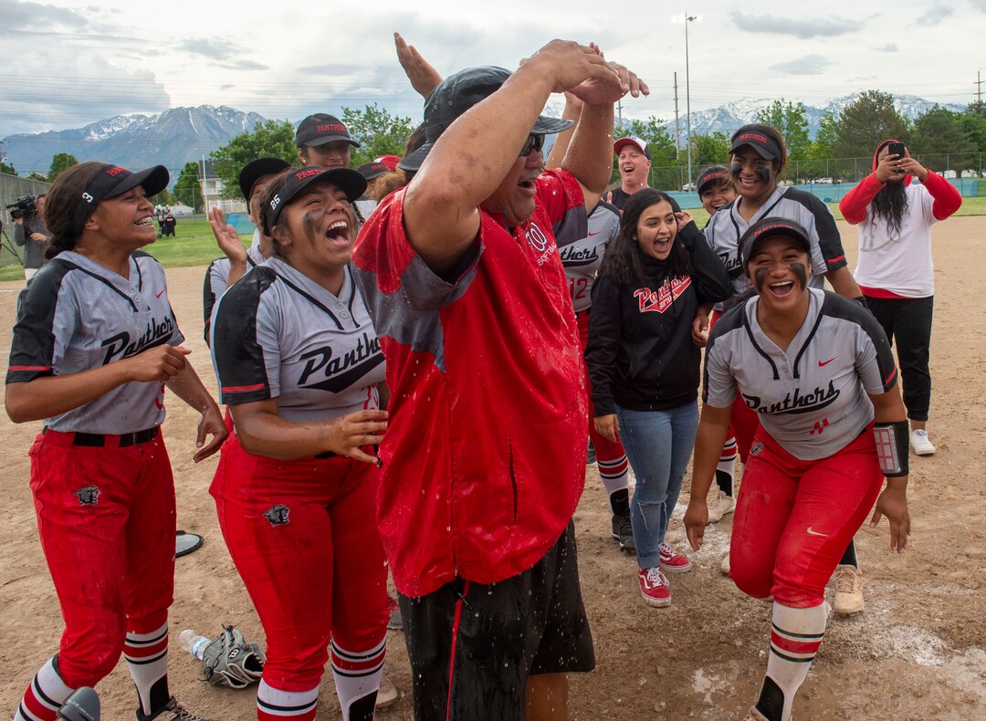(Rick Egan  |  The Salt Lake Tribune)     West High head coach Keith Lopati reacts after getting drenched with water as the Panthers celebrates their 5A State Championship win over the Bountiful Braves, in Taylorsville, Thursday May 30, 2019