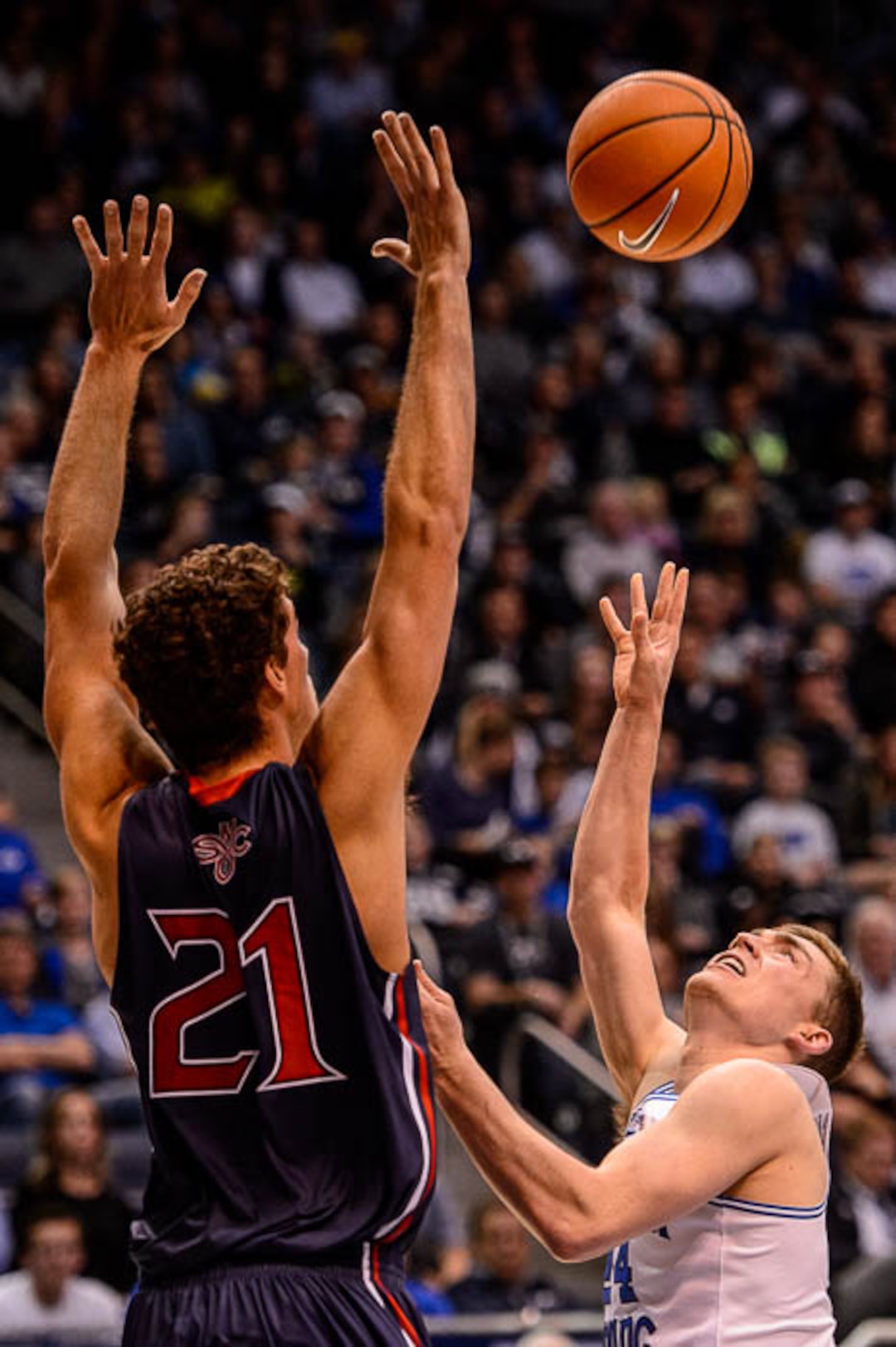 (Trent Nelson | The Salt Lake Tribune)   Brigham Young Cougars guard McKay Cannon (24) and St. Mary's Gaels center Evan Fitzner (21) as BYU hosts the St. Mary's Gaels, NCAA basketball in Provo, Saturday December 30, 2017.