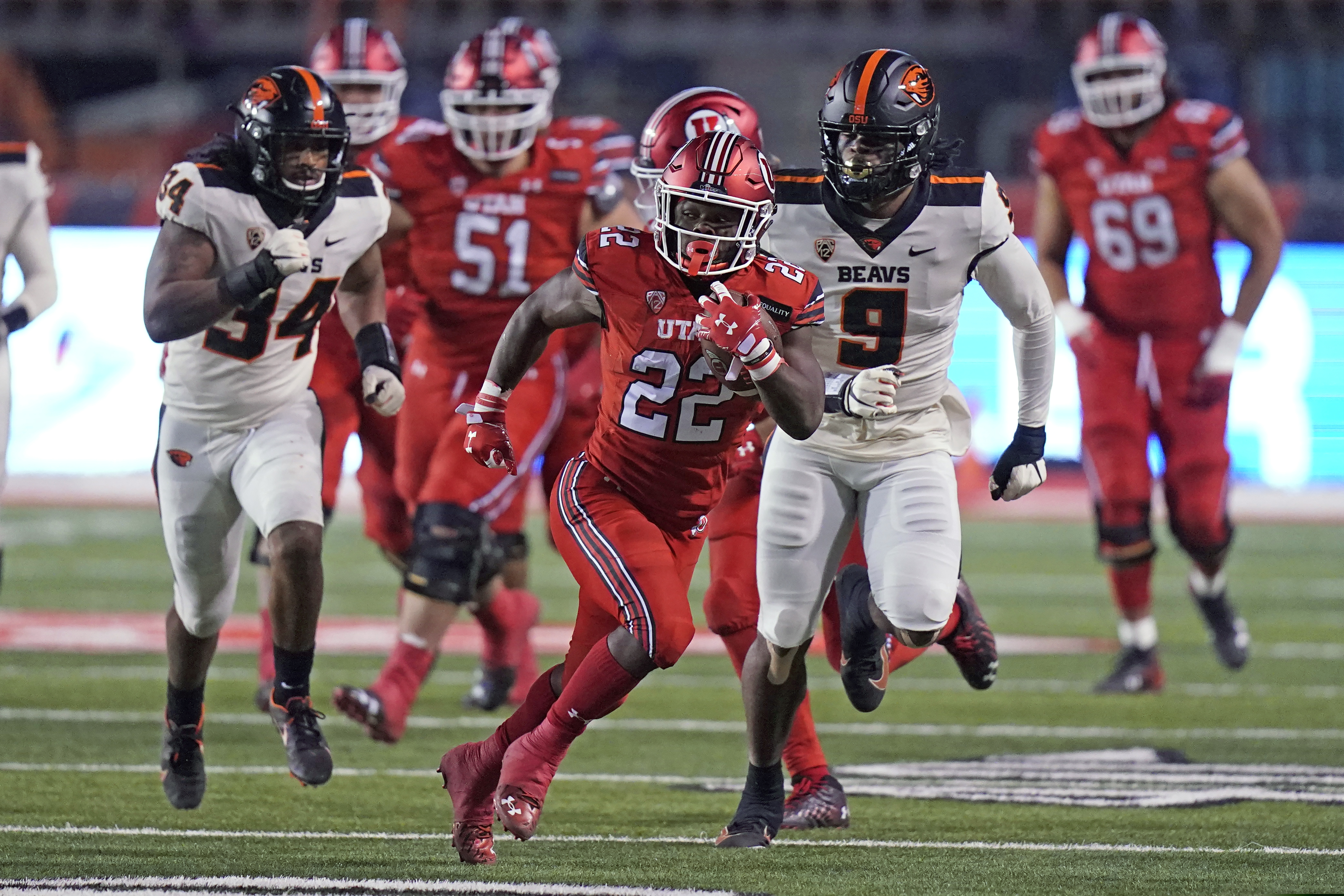 (Rick Bowmer | AP file photo) Utah running back Ty Jordan (22) carries the ball during the first half of the team's NCAA college football game against Oregon State on Saturday, Dec. 5, 2020, in Salt Lake City. Jordan died this week in Texas.