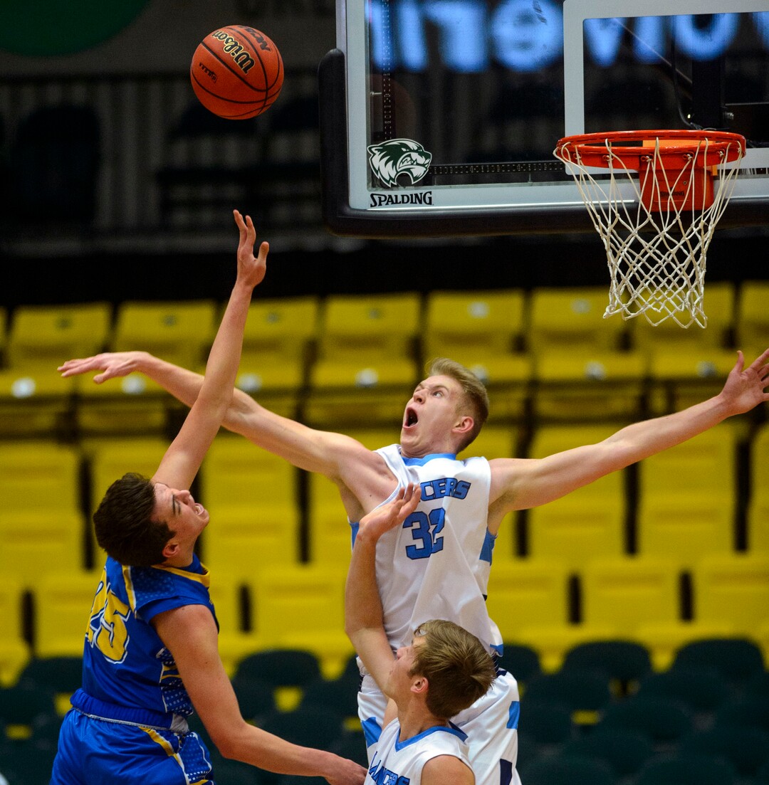 (Steve Griffin  |  The Salt Lake Tribune) Layton's Skyler Turner blocks the shot of Cyprus forward Tayven Aloi during 6A basketball playoff game at the Utah Valley UniversityÕs UCCU Center in Provo Tuesday Feb. 27, 2018.