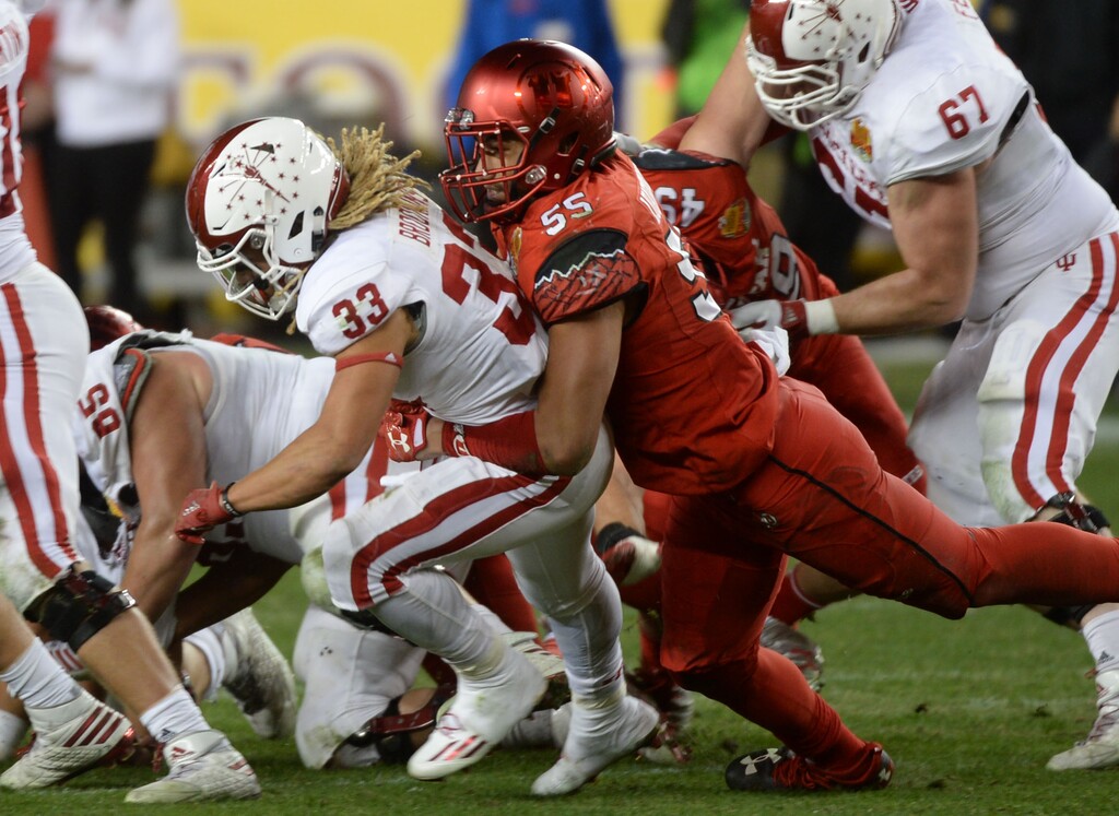Steve Griffin / The Salt Lake TribuneUtah Utes linebacker Kavika Luafatasaga (55) brings down Indiana Hoosiers running back Ricky Brookins (33) for a loss during the Foster Farms Bowl at Levi's Stadium in Santa Clara California  Wednesday December 28, 2016. 