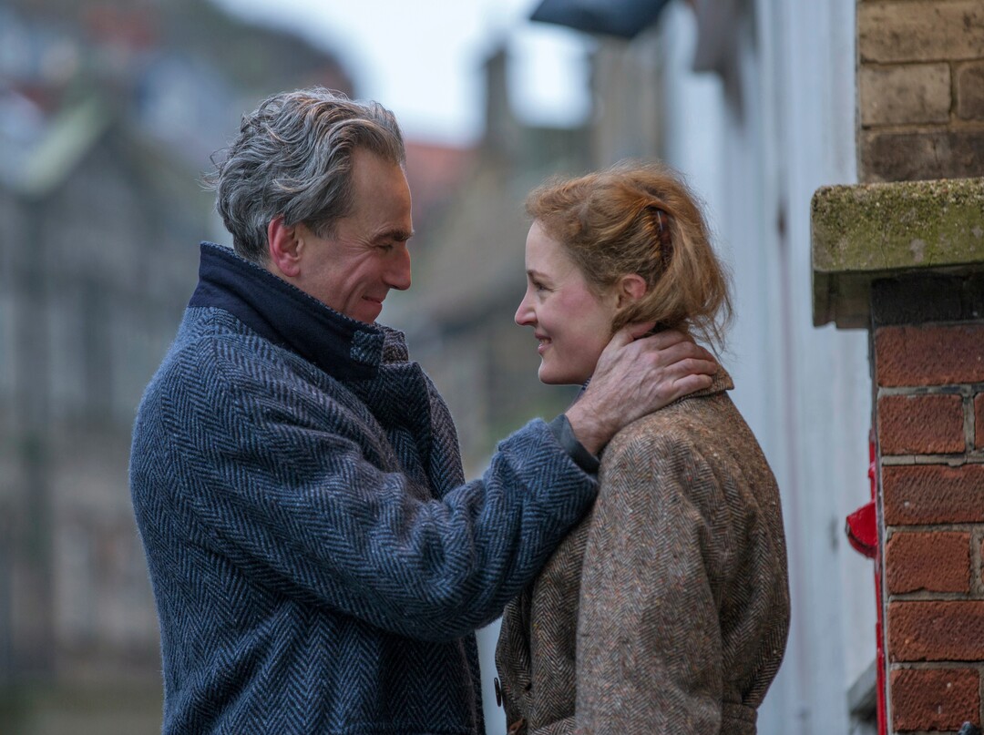 In this image released by Focus Features, Daniel Day-Lewis, left, and Vicky Krieps appear in a scene from "Phantom Thread."  (Laurie Sparham/Focus Features via AP)
