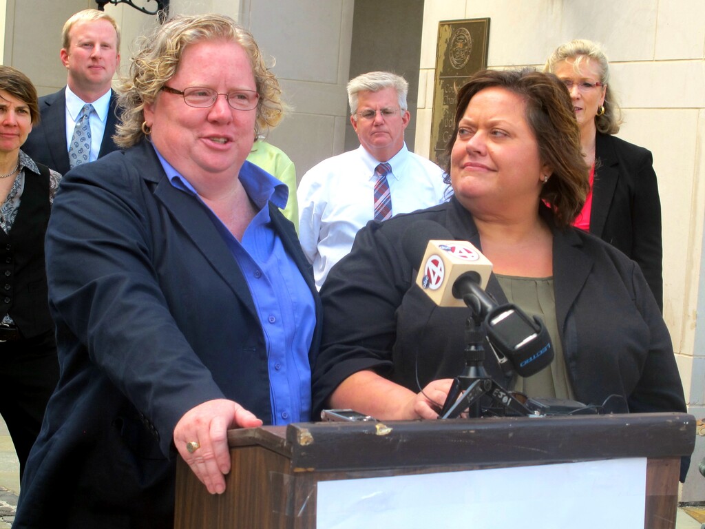 FILE - In this Oct. 15, 2014, file photo, Colleen Condon, left, and her partner Nichols Bleckley appear at a news conference in Charleston, S.C., shortly after filing a federal lawsuit seeking the right to marry in South Carolina. On Wednesday, Nov. 12, 2014, U.S. District Judge Richard Gergel ruled in their favor in the case, striking down the state's same-sex marriage ban as unconstitutional. He gave the state a week to appeal his ruling before marriage licenses will be issued. (AP Photo/Bruce Smith, File)