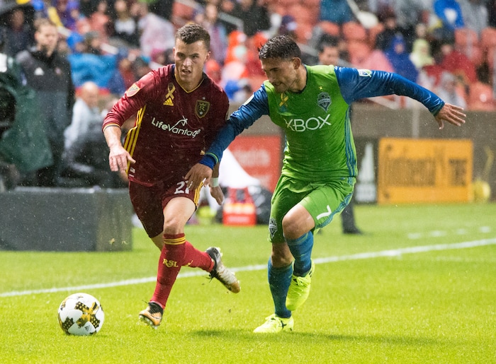 (Rick Egan  |  The Salt Lake Tribune)  Real Salt Lake forward Brooks Lennon (27) goes for the ball along with Seattle Sounders midfielder Cristian Roldan (7), in MLS soccer action, Real Salt Lake vs Seattle Sounders, in Sandy, Saturday, September 23, 2017.