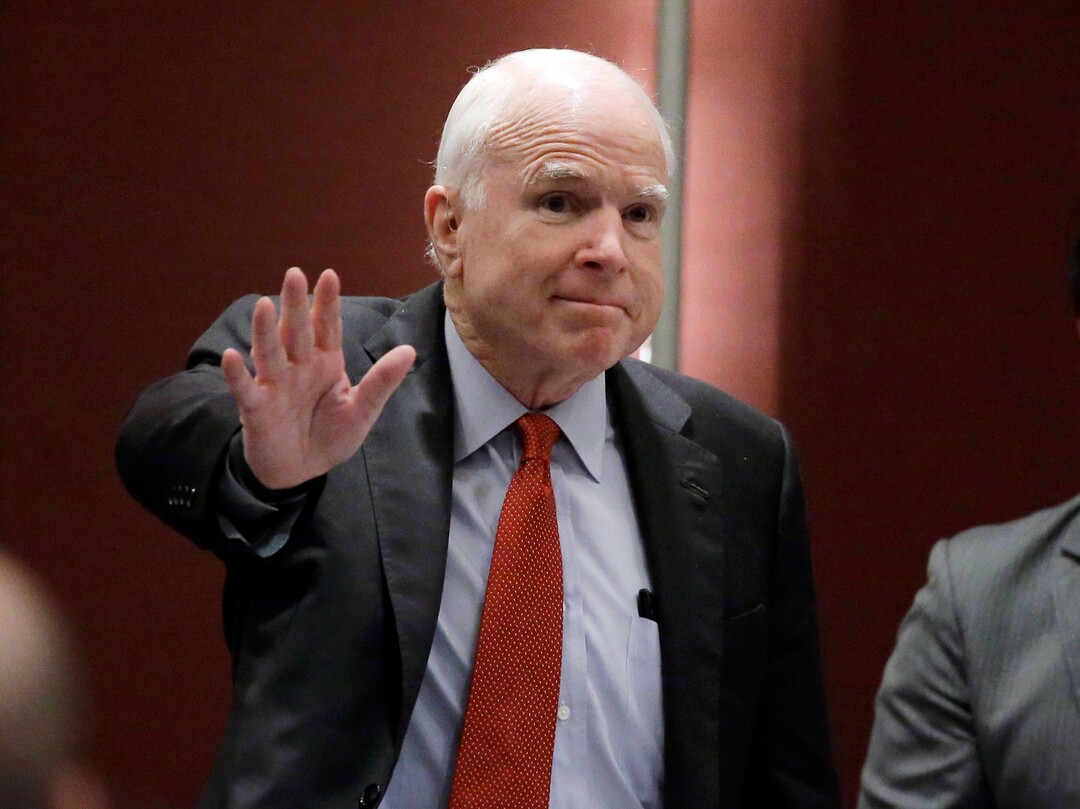 FILE - In this June 3, 2016, file photo, Sen. John McCain, R-Ariz., greets the audience as he arrives to deliver a speech in Singapore. McCain, the war hero who became the GOP's standard-bearer in the 2008 election, died Saturday, Aug. 25, 2018. He was 81. (AP Photo/Wong Maye-E, File)