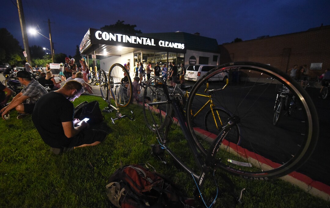 (Francisco Kjolseth  |  The Salt Lake Tribune)  A large group of cyclist gathers on the corner of 9th and 9th at 9pm in Salt Lake City on Thursday, July 26, 2018, for the weekly ride that has become known as the 999 Ride. The inclusive, all-welcoming slow casual social ride happens year round on Thursday nights, with riders often pedaling into the early morning hours. Newly released video shows rider Cameron Hooyer being struck and killed by a FrontRunner train at a downtown railroad crossing during last weeks ride when the 22-year-old failed to stop or heed the warning signals before crossing the tracks during the group ride. 