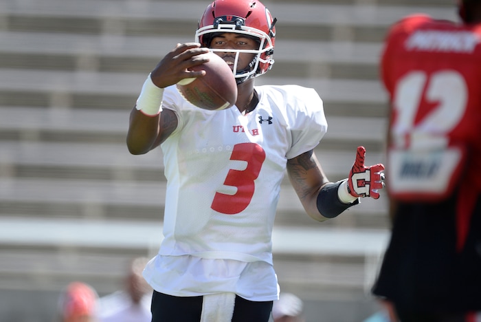 Scott Sommerdorf   |  The Salt Lake Tribune  
Utah QB  Troy Williams takes a snap during practice, Thursday, August 11, 2016. 