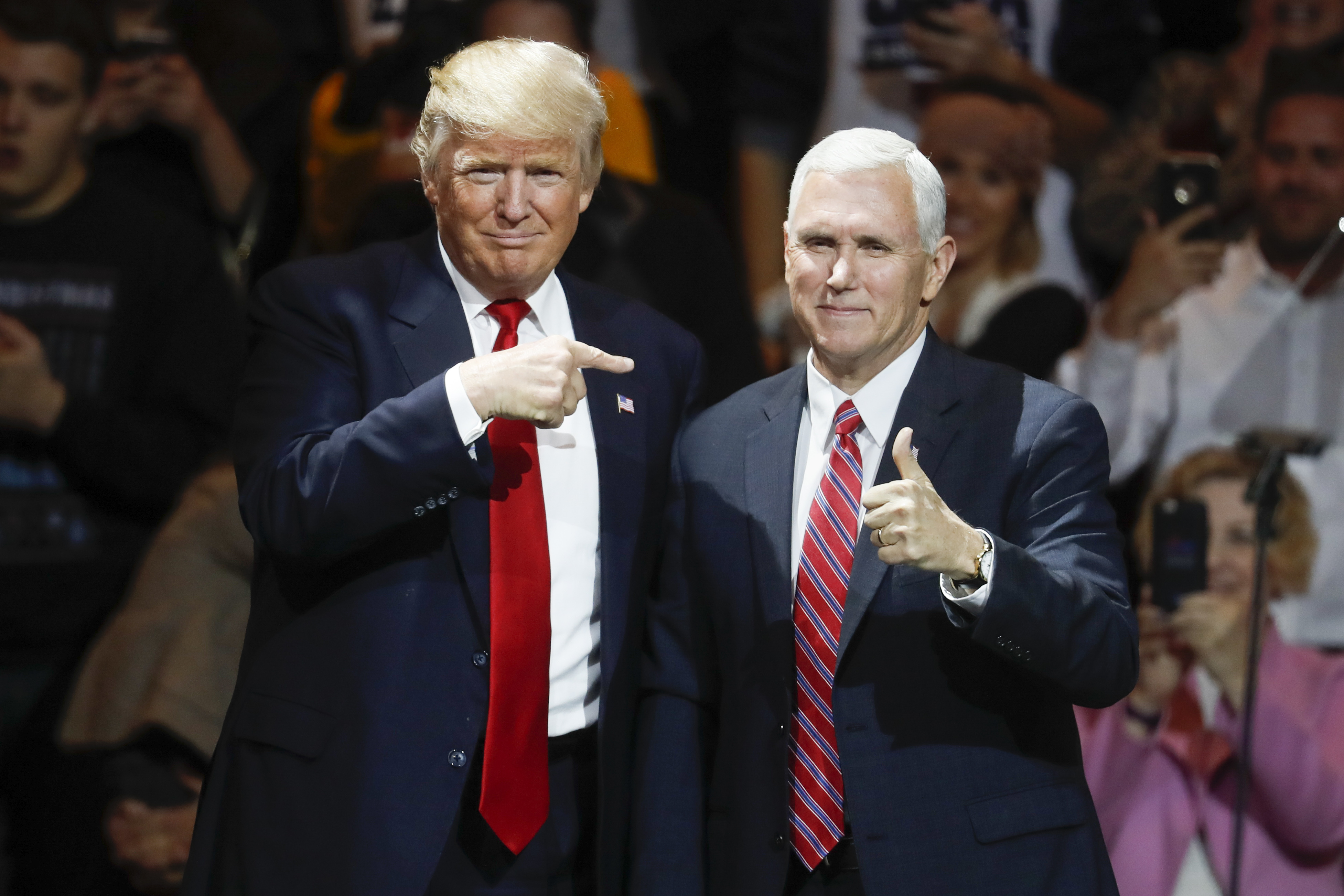(John Minchillo | AP file photo)

President-elect Donald Trump, left, and Vice President-elect Mike Pence acknowledge the crowd during the first stop of his post-election tour, in Cincinnati on Dec. 1, 2016.