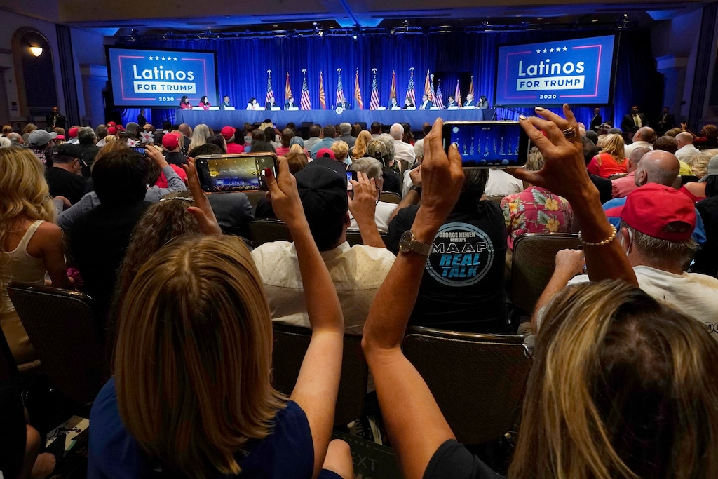 (Ross D. Franklin | AP photo)

People in the crowd take pictures as President Donald Trump participates in a Latinos for Trump Coalition roundtable campaign event Monday, Sept. 14, 2020, in Phoenix.