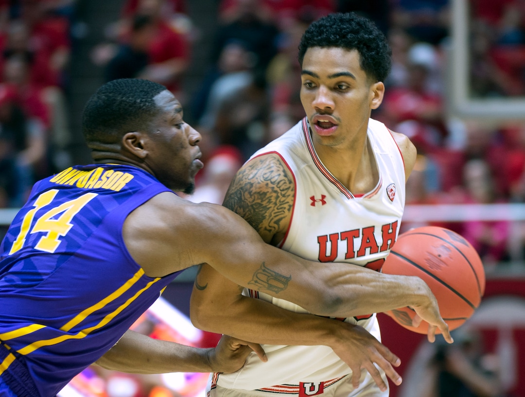 (Rick Egan  |  The Salt Lake Tribune)    Utah Utes guard Gabe Bealer (30) dribbles the ball, as LSU Tigers guard Randy Onwuasor (14) defends, in NIT playoff action between Utah Utes and LSU Tigers at the Jon M. Huntsman Center, Monday, March 19, 2018.