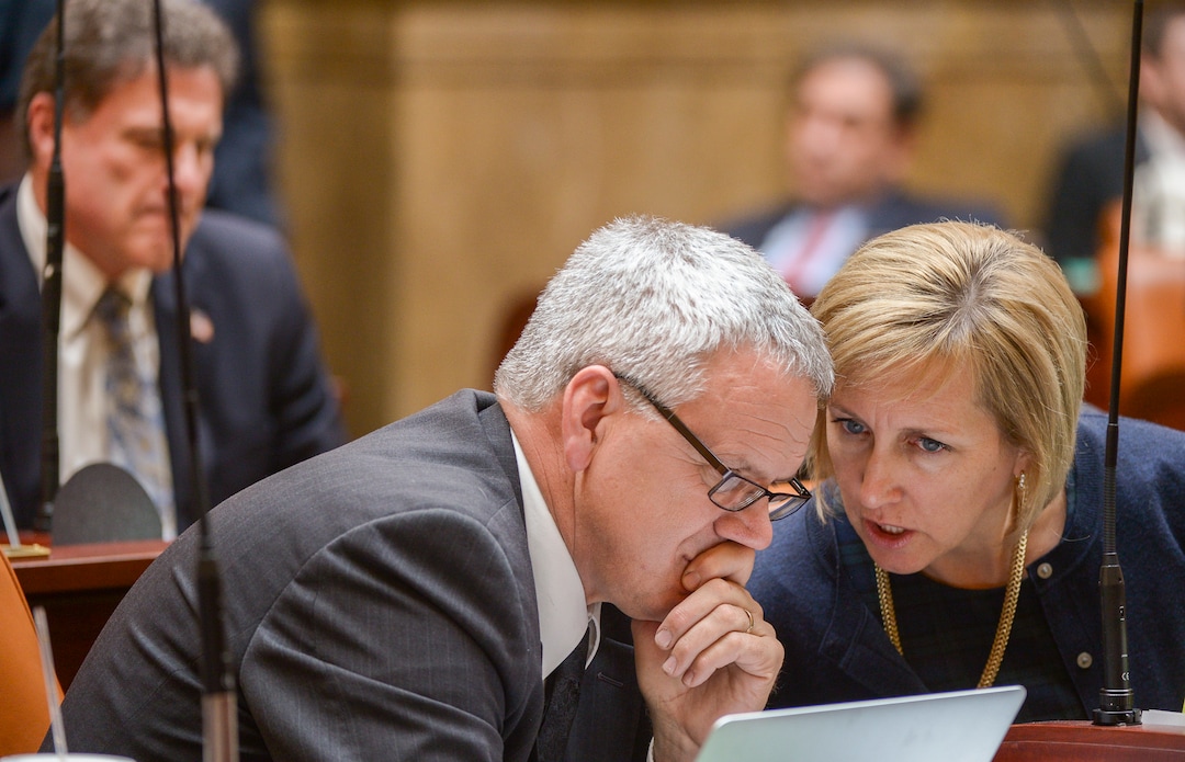 (Leah Hogsten  |  The Salt Lake Tribune)  L-r Rep. Edward Redd, R-Logan talks about the Utah Medical Cannabis Act with Rep. Karianne Lisonbee, R-Clearfield during debate on the House floor. Lawmakers overhauled the Utah Medical Cannabis Act, Monday, Dec. 2, 2018, overhauling the medical cannibis distribution system, reducing the number of medical marijuana outlets, prohibiting edibles and changing the list of illnesses that qualify for cannabis treatments.