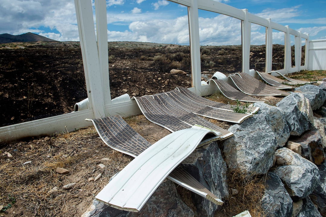 (Rick Egan  |  The Salt Lake Tribune)      The Knolls fire melted fences and did some property damage, but spared the homes on Sunrise Drive in Sunday's fire, in Saratoga Springs, Monday, June 29, 2020.