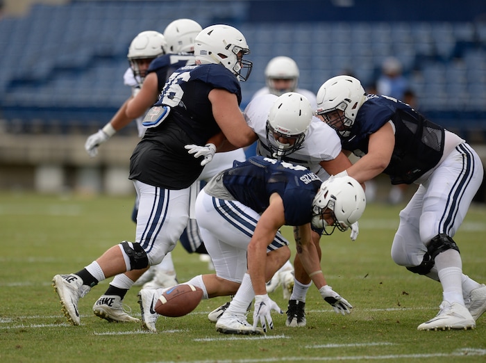 (Francisco Kjolseth  |  The Salt Lake Tribune)  Austin Kafentzis fumbles the ball as BYU holds a scrimmage at LaVell Edwards Stadium in Provo on Thursday, Aug. 10, 2017.