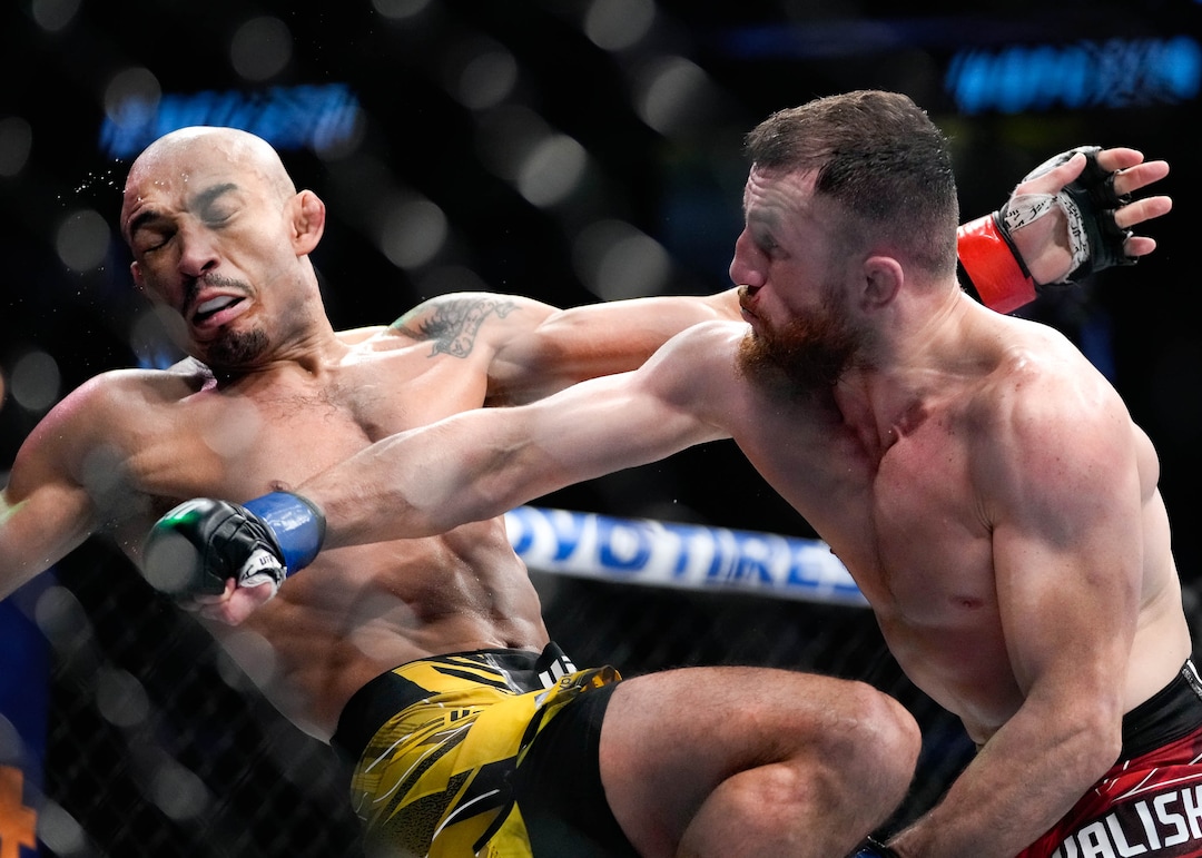 (Francisco Kjolseth | The Salt Lake Tribune) UFC bantamweight fighter José Aldo of Brazil, left, takes a hit from  Merab Dvalishvili of Georgia during their UFC 278 mixed martial arts bout in the octagon at Vivint Arena in Salt Lake City on Saturday, Aug. 20, 2022. 