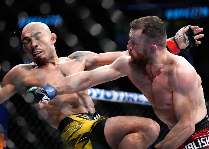 (Francisco Kjolseth | The Salt Lake Tribune) UFC bantamweight fighter José Aldo of Brazil, left, takes a hit from  Merab Dvalishvili of Georgia during their UFC 278 mixed martial arts bout in the octagon at Vivint Arena in Salt Lake City on Saturday, Aug. 20, 2022. 