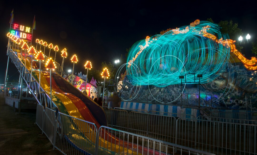 (Rick Egan  |  The Salt Lake Tribune)   The Fun Slide and Moby Dick light up the midway at the Utah State Fair, on a busy Monday evening , Sept. 10, 2018.