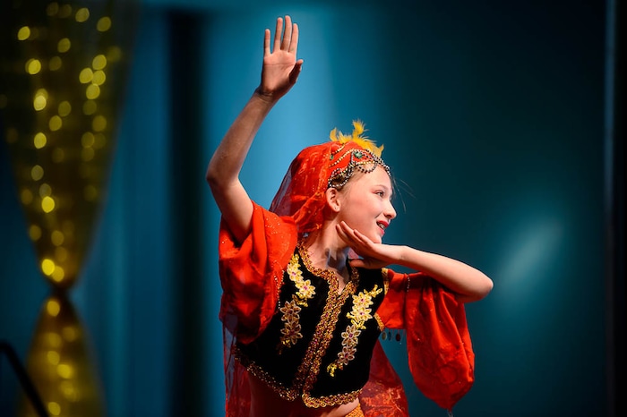 (Trent Nelson | The Salt Lake Tribune)  Rebecca Rogness of the Leah Chinese Arts Dance School performs The Little Girl in the Flowers at the Chinese New Year Celebration at the County Library's Viridian Event Center in West Jordan, Saturday Feb. 17, 2018.