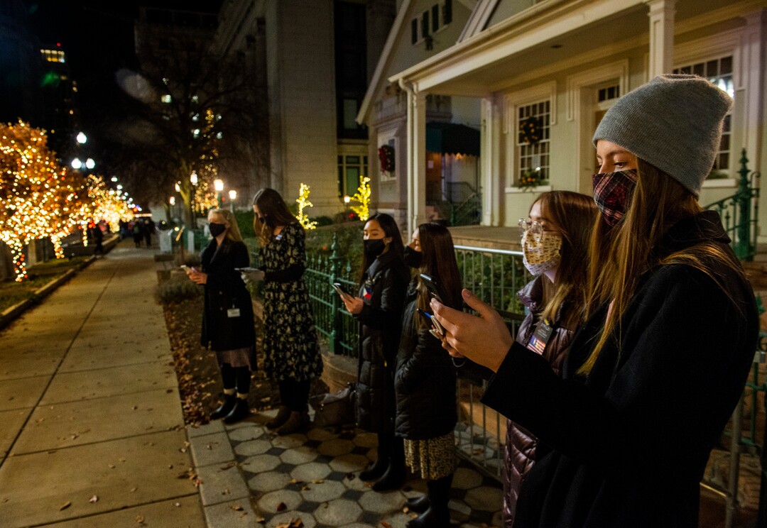 (Rick Egan | The Salt Lake Tribune)  Temple Square is closed, but sister missionaries sing Christmas carols in front of the Beehive House, in downtown Salt Lake City, Friday, Nov. 27, 2020.
