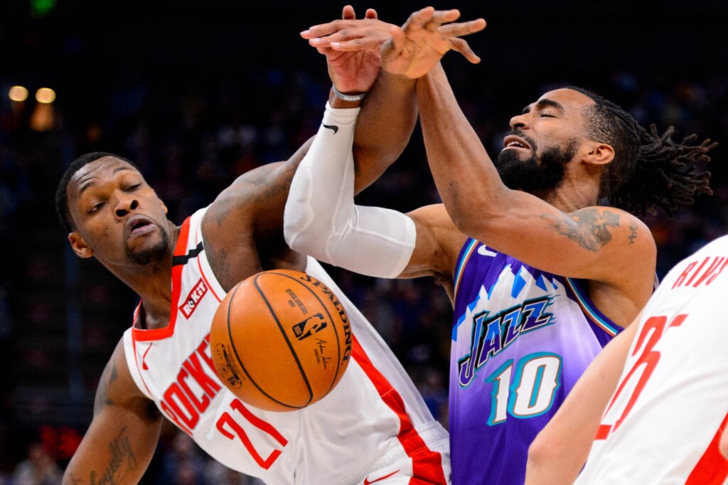 (Trent Nelson | The Salt Lake Tribune) Houston Rockets guard Michael Frazier (21) fouls Utah Jazz guard Mike Conley (10) as the Utah Jazz host the Houston Rockets, NBA basketball in Salt Lake City on Monday, Jan. 27, 2020.