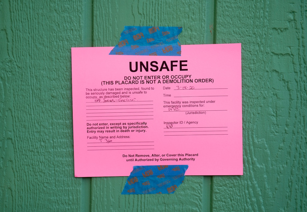 (Jeremy Harmon  |  The Salt Lake Tribune) A home in Magna, Utah, is marked as unsafe to enter following an earthquake that hit the area on Wednesday, March 18, 2020.