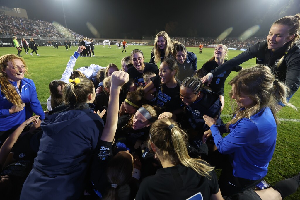 (Jaren Wilkey | BYU) The BYU women's soccer team celebrates a win over defending champs Santa Clara on Friday. The Cougars advanced on penalties and will now play in their first ever NCAA soccer final.