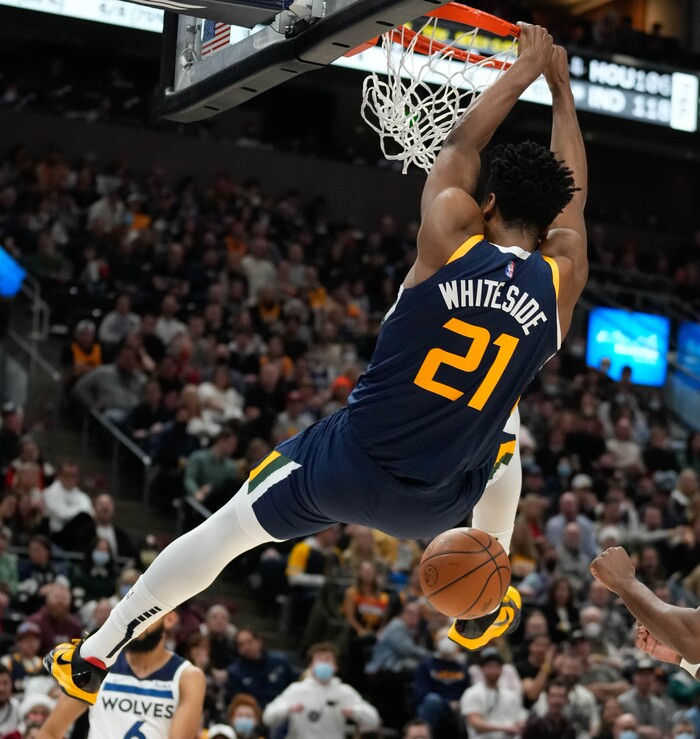 (Francisco Kjolseth | The Salt Lake Tribune) Utah Jazz center Hassan Whiteside (21) lands a monster dunk in NBA action between the Utah Jazz and the Minnesota Timberwolves at Vivint Smart Home Arena in Salt Lake City, Thursday, Dec. 23, 2021.