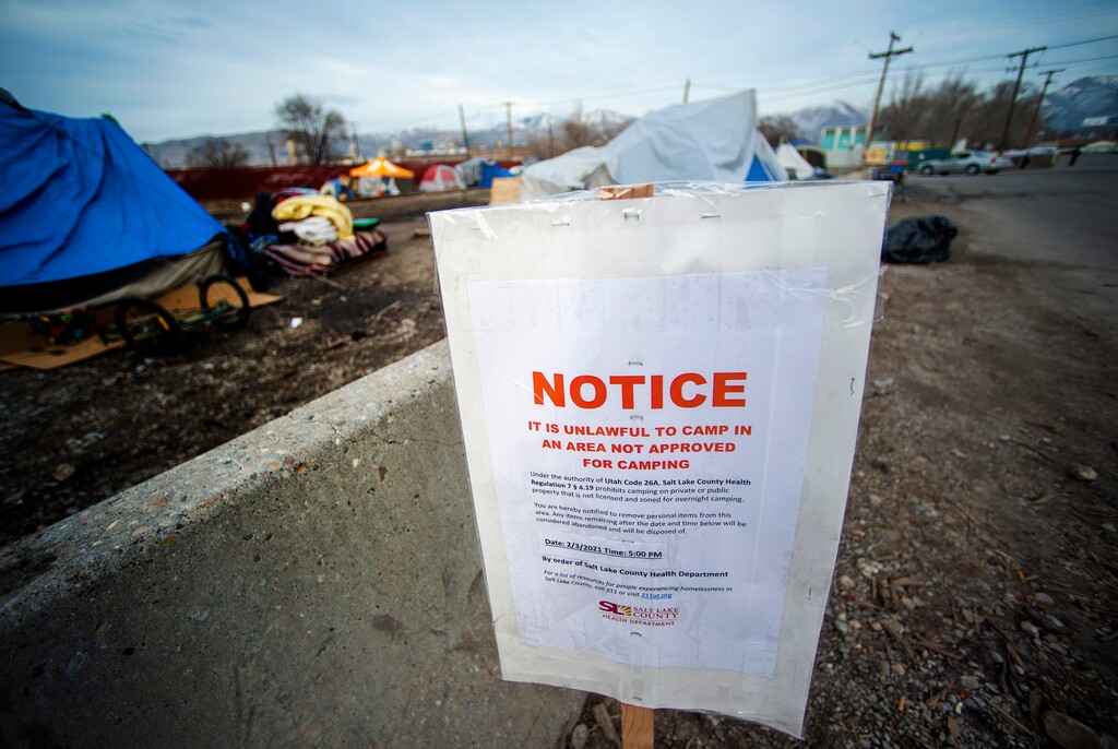 (Rick Egan | The Salt Lake Tribune)  A sign posted by the Salt Lake County Health Department Monday, Feb. 2, 2021, announcing that everyone was to be off the property for an abatement. Most of the unsheltered people who had been living in Camp Last Hope have dispersed to other, smaller encampments. 2021.