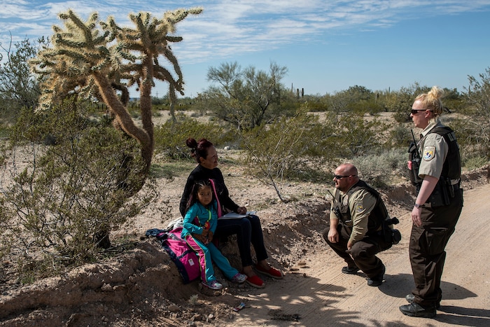 (Adriana Zehbrauskas | The New York Times) Agents from the Fish and Wildlife Agency detained Coromoto Ureña, a Venezuelan migrant, and her 4-year-old granddaughter, Maria José, in the Organ Pipe Cactus National Monument near Lukeville, Ariz. Feb. 19, 2020. Federal courts allowed the Trump administration to speed construction of the border wall by waiving dozens of laws, including measures protecting endangered species and Native American burial sites.
