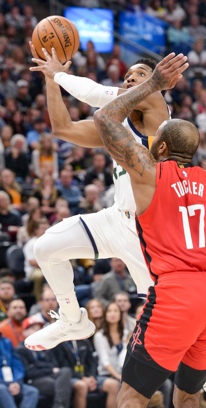 (Leah Hogsten  |  The Salt Lake Tribune)  Utah Jazz guard Donovan Mitchell (45) hits the net. The Utah Jazz host the Houston Rockets at Vivint Arena, Feb. 22, 2020.